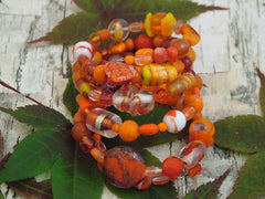 4 Strand Glass lampwork bead, crystal bead Memory Wire Bracelet, oranges