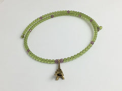 Peridot green and purple glass with Gold tone Pewter Eiffel Tower Centerpiece Memory Wire Choker