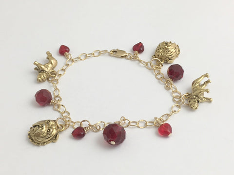 14k gold filled bracelet with goldtone pewter charms and red accent beads