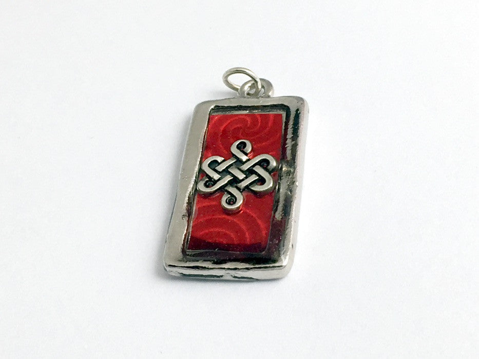 Pewter frame, red spiral holographic paper, pewter Celtic knot pendant-resin