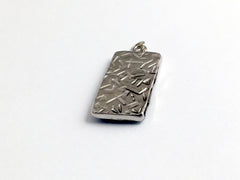 Pewter frame, red spiral holographic paper, pewter Celtic knot pendant-resin