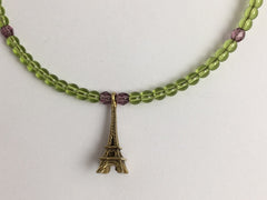Peridot green and purple glass with Gold tone Pewter Eiffel Tower Centerpiece Memory Wire Choker