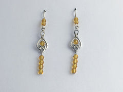 Sterling Silver oblong Celtic Knot dangle earrings-amber color glass, knots